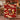 Couple holding a personalized Christmas Pudding Supper woven blanket with custom names woven in