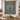 Christmas Rose Medallion woven blanket displayed as a wall tapestry above a candlelit dining table