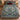 Christmas Rose Medallion woven blanket spread on a bed with blue and red pillows