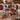 Christmas Story Patchwork Quilt photo blanket with family photos and custom name draped over a cream sofa