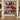 Personalized Christmas Story Patchwork Quilt photo blanket with family photos displayed on a wall