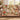 Christmas Tea Garden woven throw draped over a sofa, teapot, teacups, poinsettias and red berries with the sample name The Thompsons