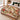 Christmas Tea Garden woven throw across the foot of a bed with soft folds, colorful fringe and the sample name The Thompsons