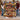 Couple holding a personalized Christmas train photo blanket with six family photos