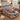 Christmas Tree Farm Red Truck quilt bedding set with 2 matching pillowcases in a snowy-view holiday bedroom
