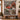 Christmas Tree Farm Red Truck woven blanket displayed as a wall tapestry above a bench with a vintage sled