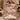 Couple holding a personalized Christmas tree farm woven blanket with custom name woven in