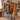 Couple holding a personalized Christmas tree homecoming woven blanket with custom name woven in