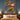 Christmas tree house woven blanket displayed as a Christmas wall tapestry above a bed