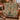 Christmas Tree of Life woven blanket draped over a leather sofa