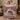 Couple holding a personalized Christmas wreath market woven blanket with custom name woven in