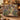 Clematis Garden Door woven blanket draped over an armchair in a cozy room