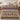 Cranberry harvest sampler woven blanket spread on a bed