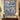 Delft Blue Amaryllis Garden woven blanket displayed as a wall tapestry above a console table