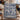 Delft Blue Amaryllis Garden woven blanket draped over a staircase banister with Christmas garland