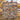 Couple holding a personalized Denim Terracotta Balloon Valley Pattern woven blanket with custom family name in an autumn river valley