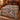 Blue and terracotta hot air balloon pattern woven blanket spread on a bed