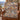 Denim Terracotta Balloon Valley Pattern woven blanket draped over a leather armchair