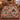 Desert Cactus Flower Christmas woven blanket with custom family name spread on a bed