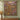 Dewdrop Gossamer Meadow woven blanket displayed as a wall tapestry above a wooden console on a sage green wall