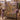 Dewdrop Gossamer Meadow woven blanket draped over a mauve wingback armchair
