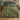 Dragonfly Rush Pool woven blanket with custom family name spread on a bed
