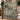 Evergreen Reindeer Herd woven blanket draped over a staircase banister with Christmas garland