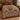 Feather Sun Turkey woven blanket spread on a bed