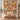 Personalized Floral Patchwork Golden Terracotta quilt with custom family name hung on a wall above a bench with 2 matching pillowcases