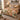 Floral Patchwork Golden Terracotta quilt bedding set with 2 matching pillowcases on a bed in a cozy bedroom