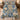 Floral Patchwork Porcelain Blue quilt bedding set with 2 matching pillowcases on a bed in a cozy bedroom