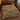 Forest Floor Cabin Creek woven blanket spread on a bed