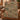 Forest Floor Cabin Creek woven blanket styled on an armchair