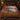 Foxhound Misty Lake Chase woven blanket spread across a bed like a bedspread