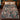 Garden masquerade woven blanket spread on a bed