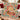 Gingerbread Bakehouse Christmas fleece throw draped over a sofa