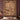 Gingerbread Christmas Baking woven blanket displayed as a wall tapestry above a bed