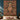 Gingerbread Christmas Patchwork woven blanket displayed as a wall tapestry above a bed