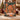 Holding a personalized Gingerbread Icing Village woven blanket with custom family name on the ribbon