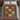 Gingerbread Men Cookie Patchwork woven blanket spread on a bed with blue bedding