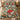 Glasshouse Poinsettia Noel duvet cover set with 2 matching pillowcases at the foot of a bed
