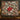 Glasshouse Poinsettia Noel Christmas woven blanket hung as a wall tapestry in a festive living room