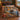 Bull moose and autumn lake woven blanket spread on a bed in a log cabin bedroom