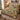 Golden Leopard Botanical quilt bedding set with 2 matching pillowcases on a bed in a cozy bedroom