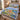 Personalized Grand Valley State campus quilt bedding set with custom name in a bedroom