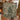 Couple holding a personalized Green Cream Woodland Christmas woven blanket with custom names woven in