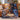 Hadestown Seasons Below Stage fleece throw draped over a sofa