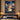 Hamilton Schuyler Sisters Christmas woven blanket displayed as a wall tapestry above a navy upholstered bed