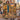Couple holding a personalized Hanukkah Lights of Jerusalem woven blanket with custom family name beside a menorah