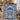 Couple holding a personalized Hanukkah Papercut Menorah fleece blanket with custom family name